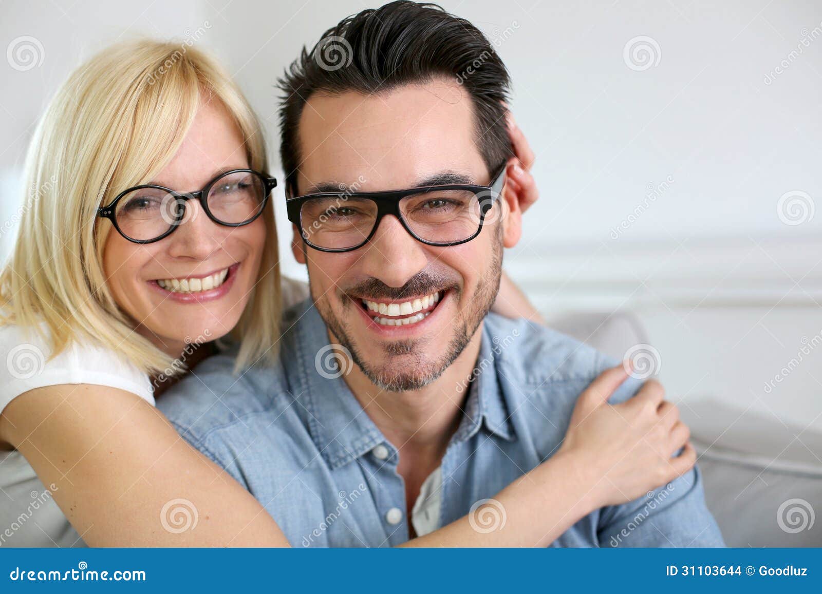funny couple at home with eyeglasses