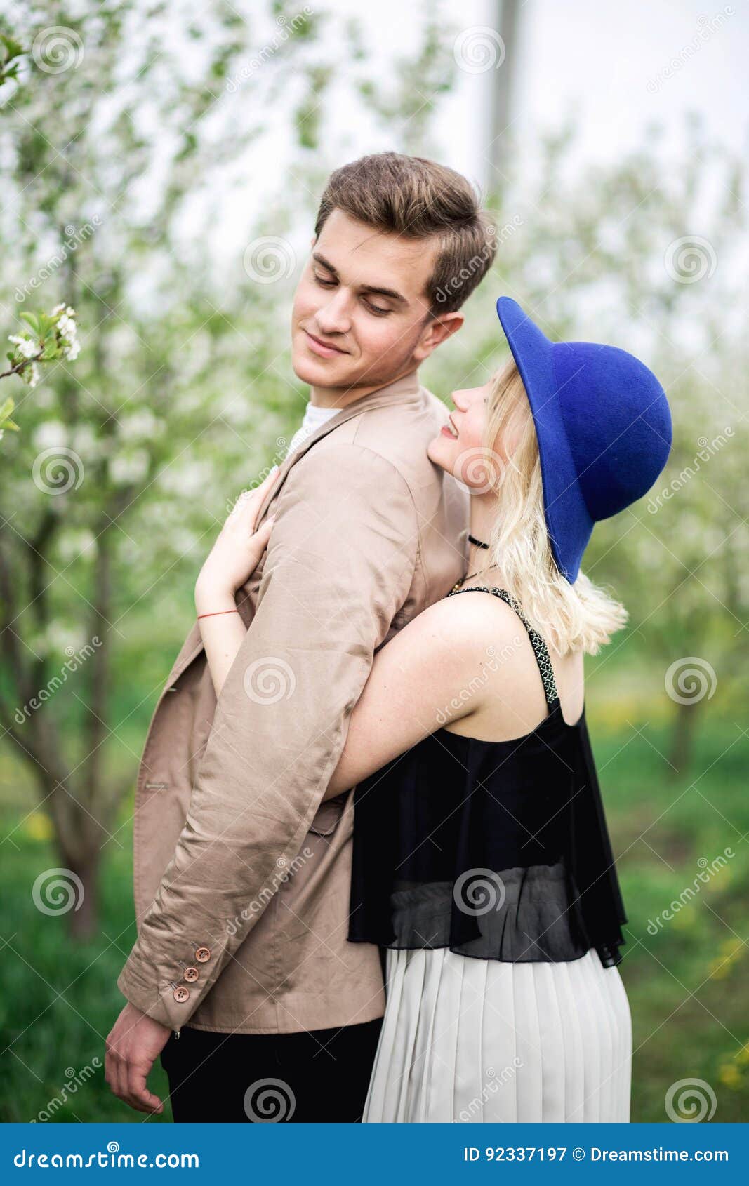 Funny Couple Laughing With A White Perfect Smile And Looking Each Other Outdoors Stock Image