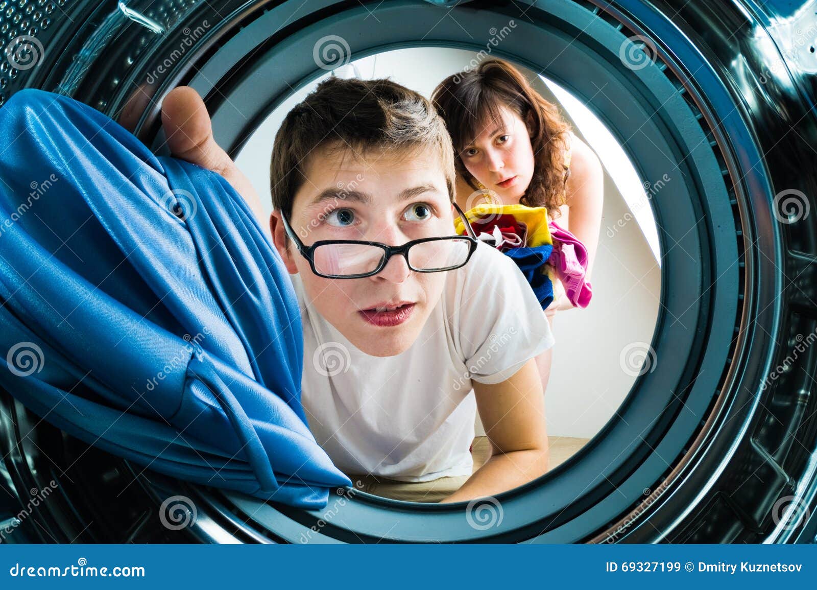 Funny Couple Loading Clothes To Washing Machine Stock Image Image of