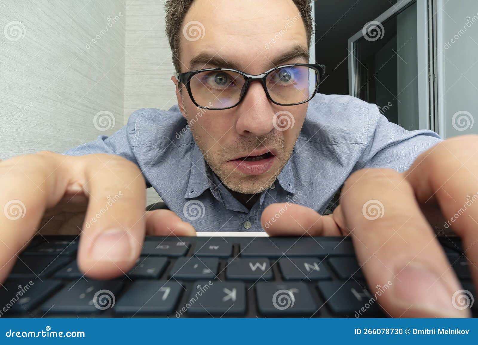 Funny and Crazy Man Using a Computer on White Background. Man`s Hands