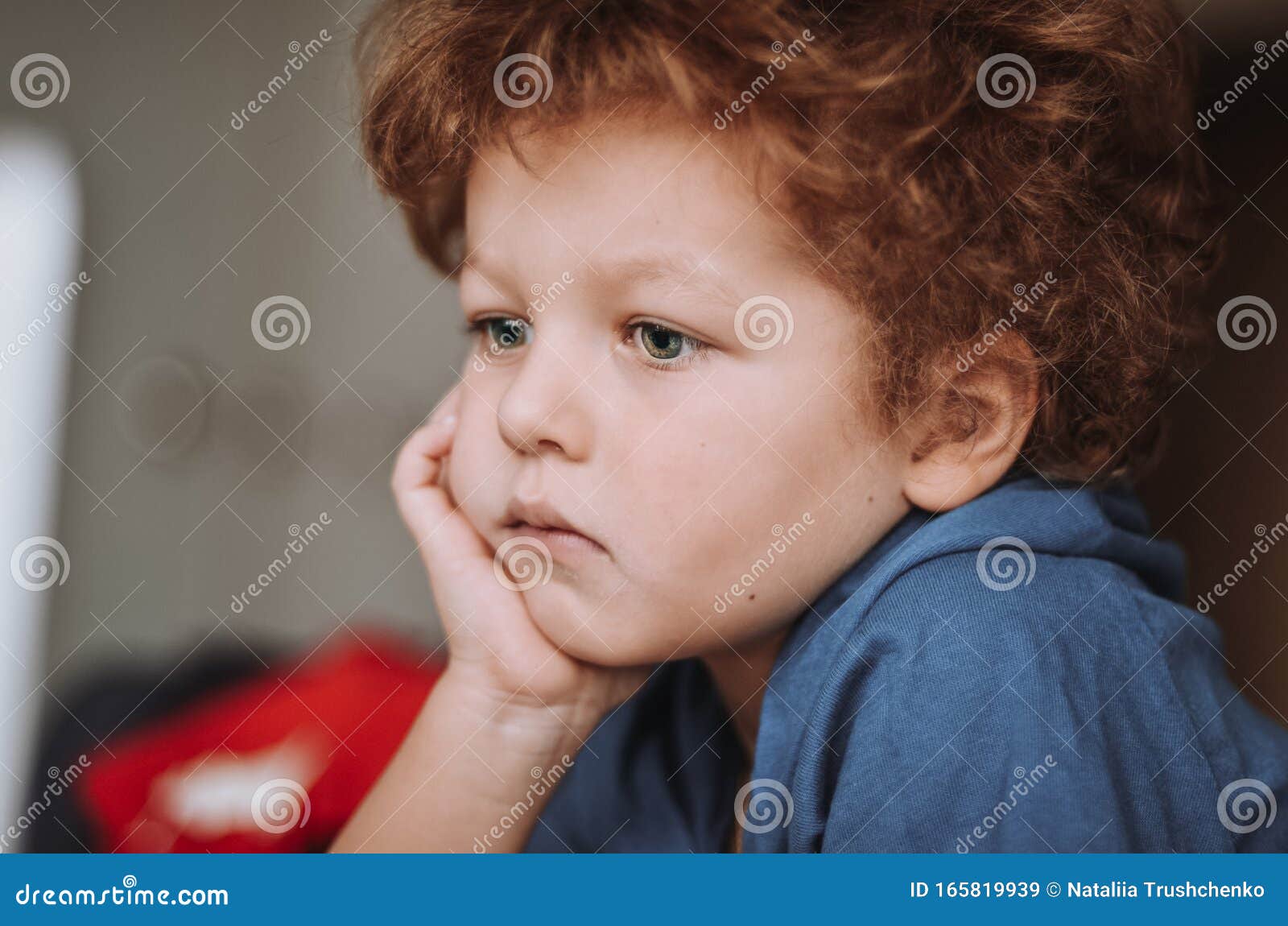 Funny Curly-haired Amazing Boy Lies on His Stomach and Holds His Fist Under His Chin is Pensive and Handsome Stock Image - Image of happiness, amazed: 165819939 Funny Curly-haired Amazing Boy Lies on His Stomach and Holds His Fist Under His Chin is Pensive and Handsome Stock Image - Image of happiness, amazed: 165819939