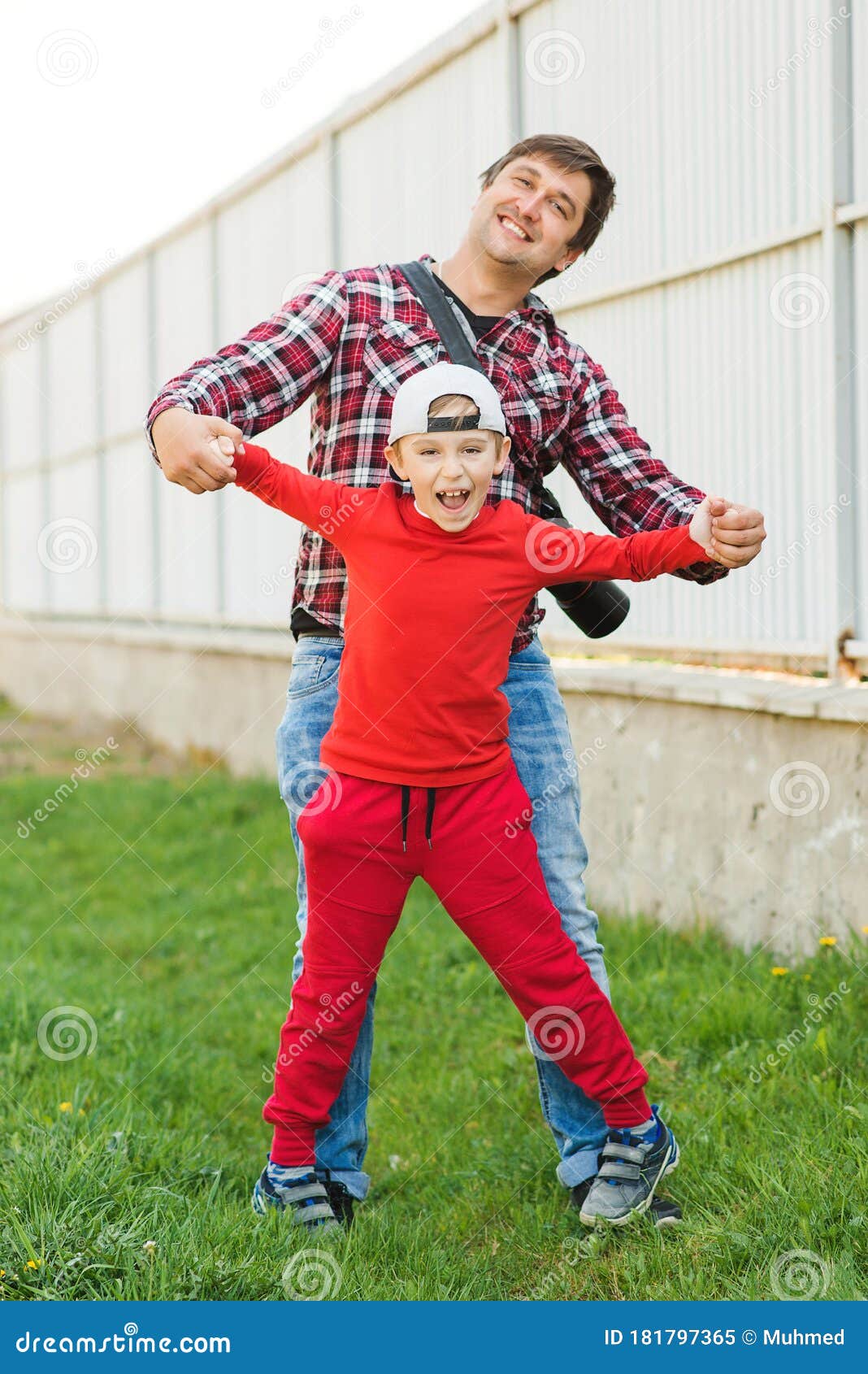 Funny Dad And Son Fooling Around Outdoors Father With Son Having Fun Together Stock Image