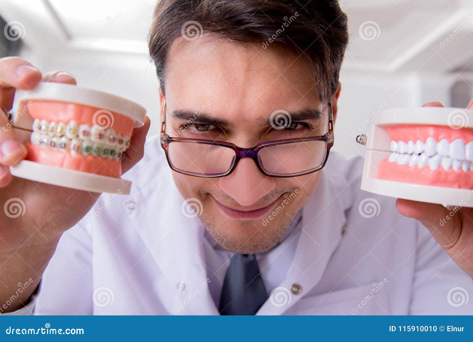 The Funny Dentist with Teeth Model in Hospital Stock Photo Image of