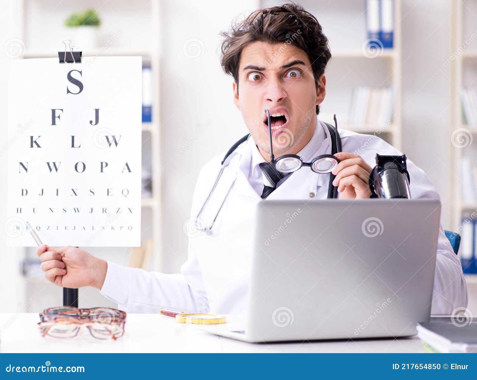 Eyeglass With Humorous Eyetest Chart Royalty Free Stock Image 65488126 