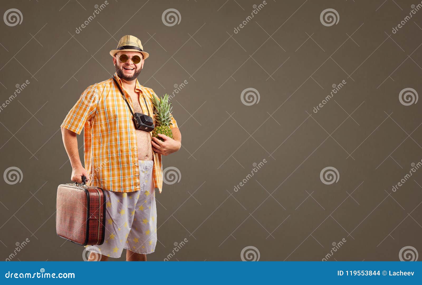 a funny fat bearded tourist with a pineapple and a suitcase smil