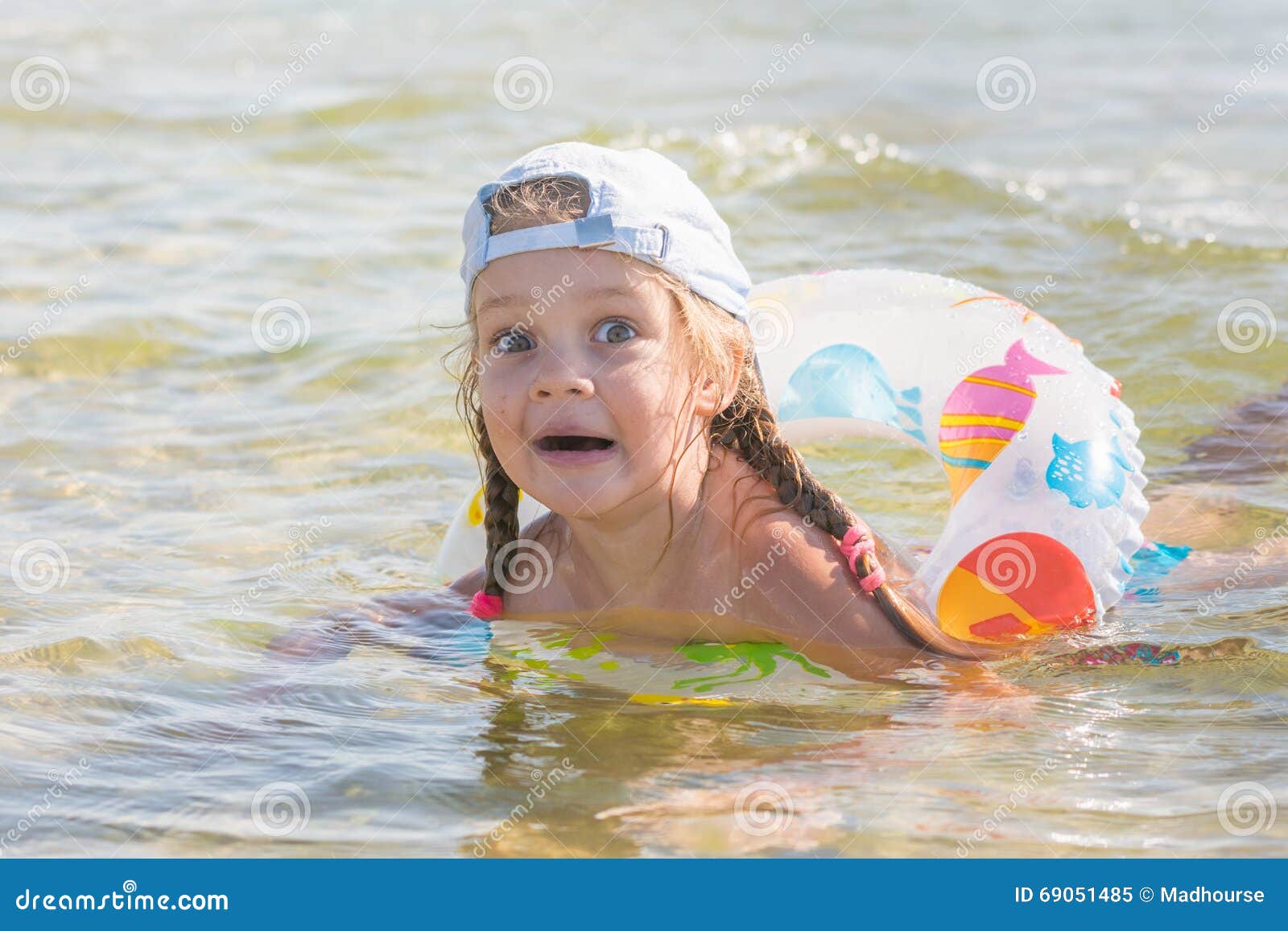 Funny Four-year Girl Floats with a Circle in the Water Stock Image ...