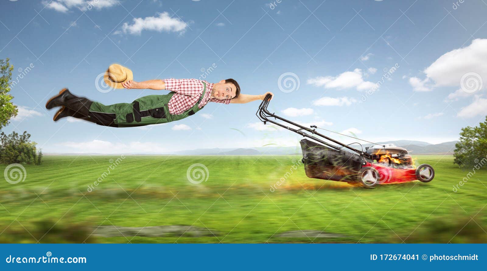 Funny Gardener Being Pulled Across the Lawn by a Lawn Mower Stock Image