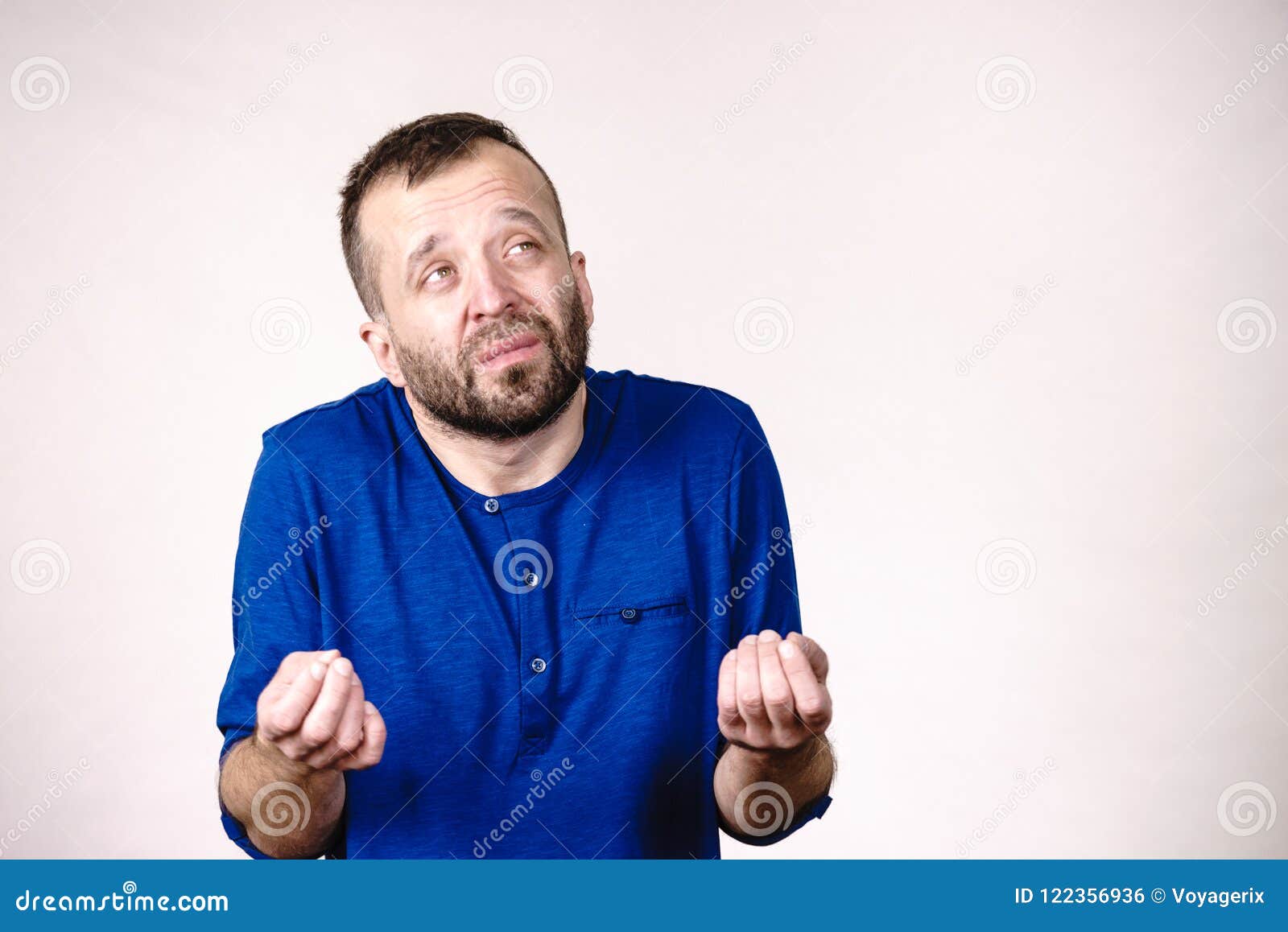 Man begging or apologizing stock photo. Image of face - 122356936