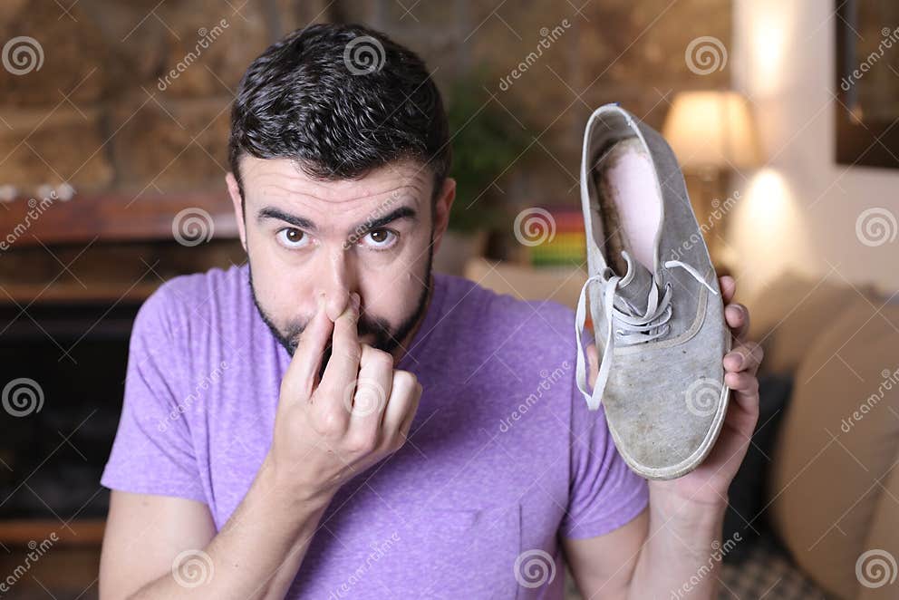 Funny Guy Smelling Shoe with Fungus Stock Photo - Image of lifestyle ...