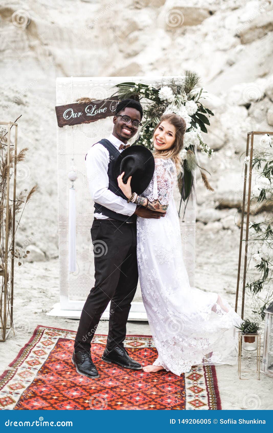 Funny Hippy Wedding Couple Dressed in Boho Style are Staying before the  Wedding Arch in Canyon Outdoors and Smiling Stock Image - Image of  beautiful, laugh: 149206005