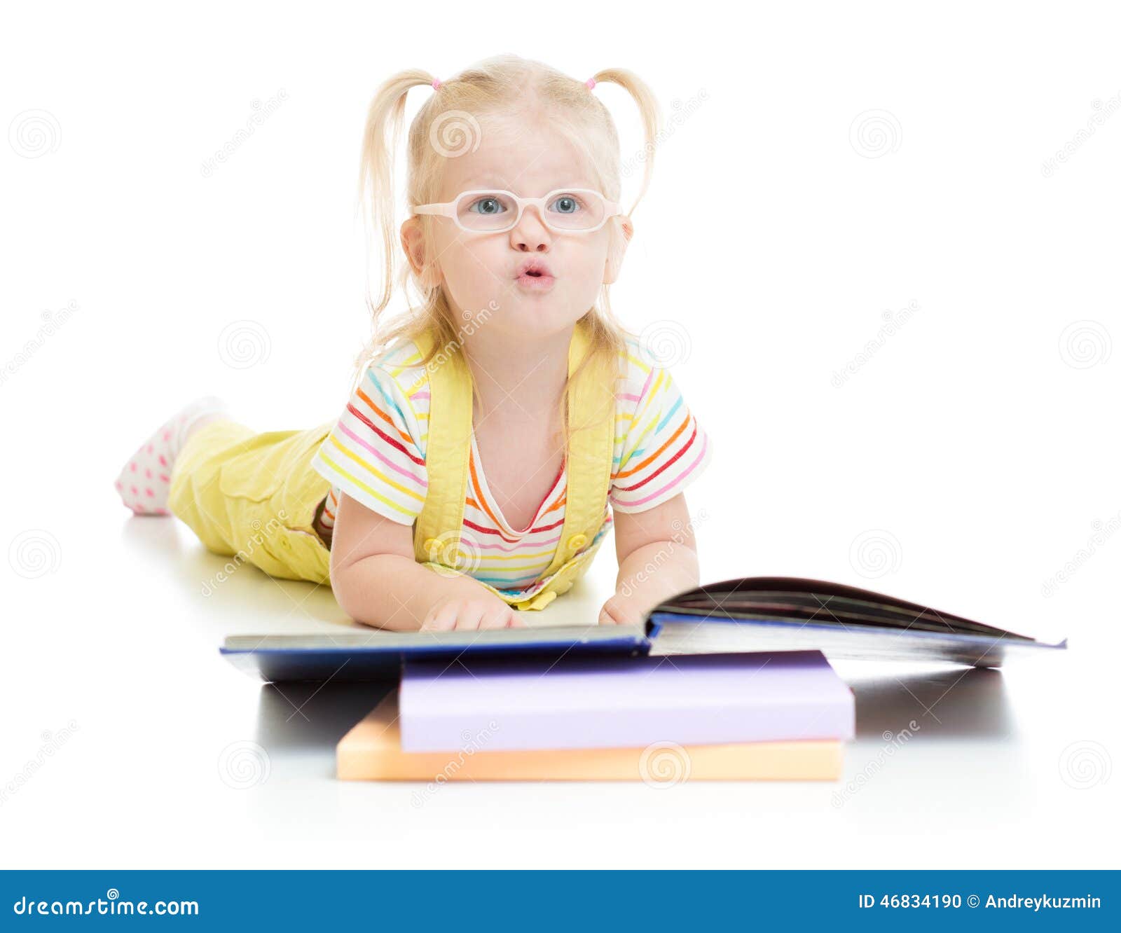 funny kid in eyeglases reading book 