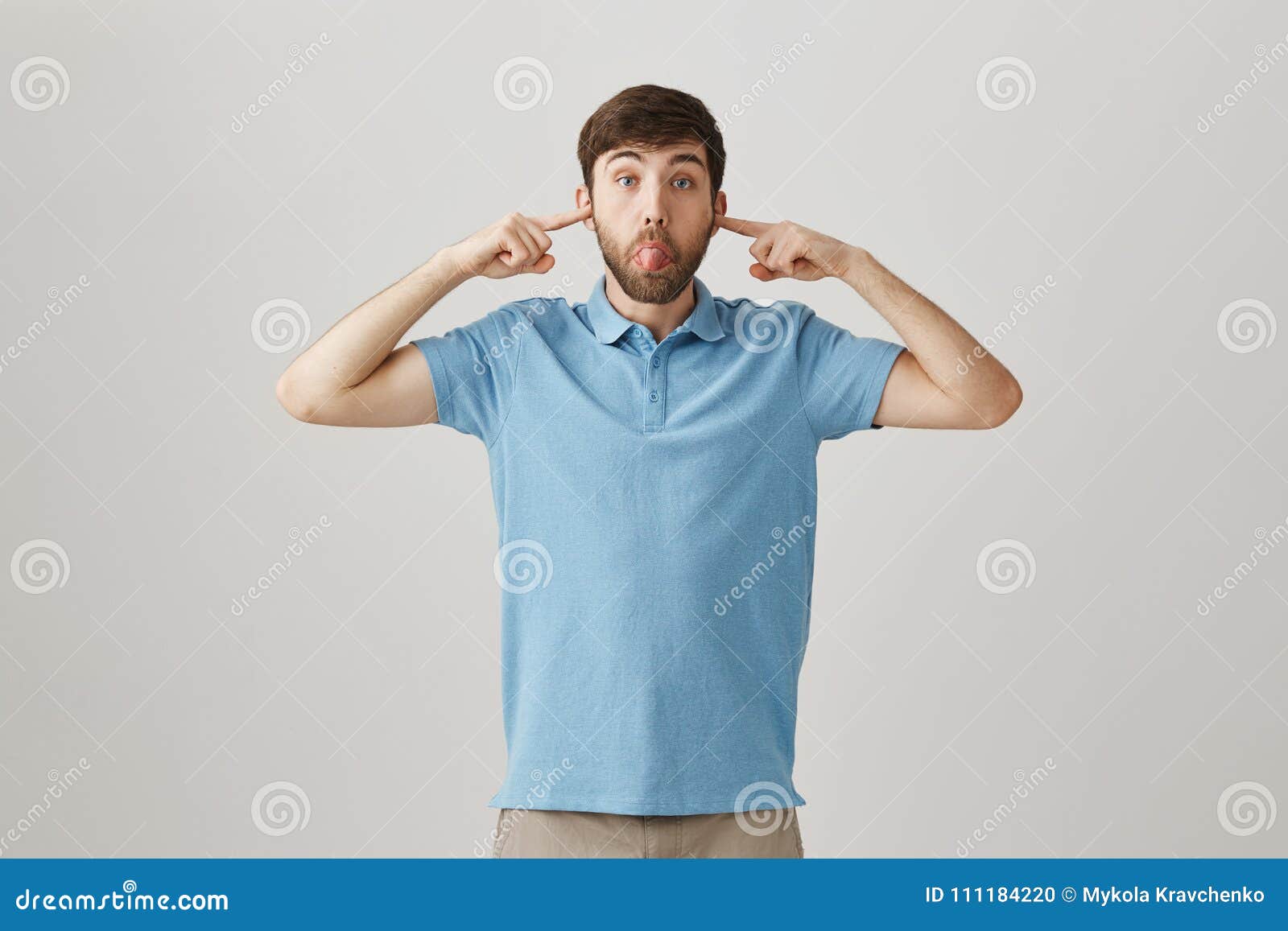 Funny Male Covering Ears with Index Fingers while Making Faces and ...