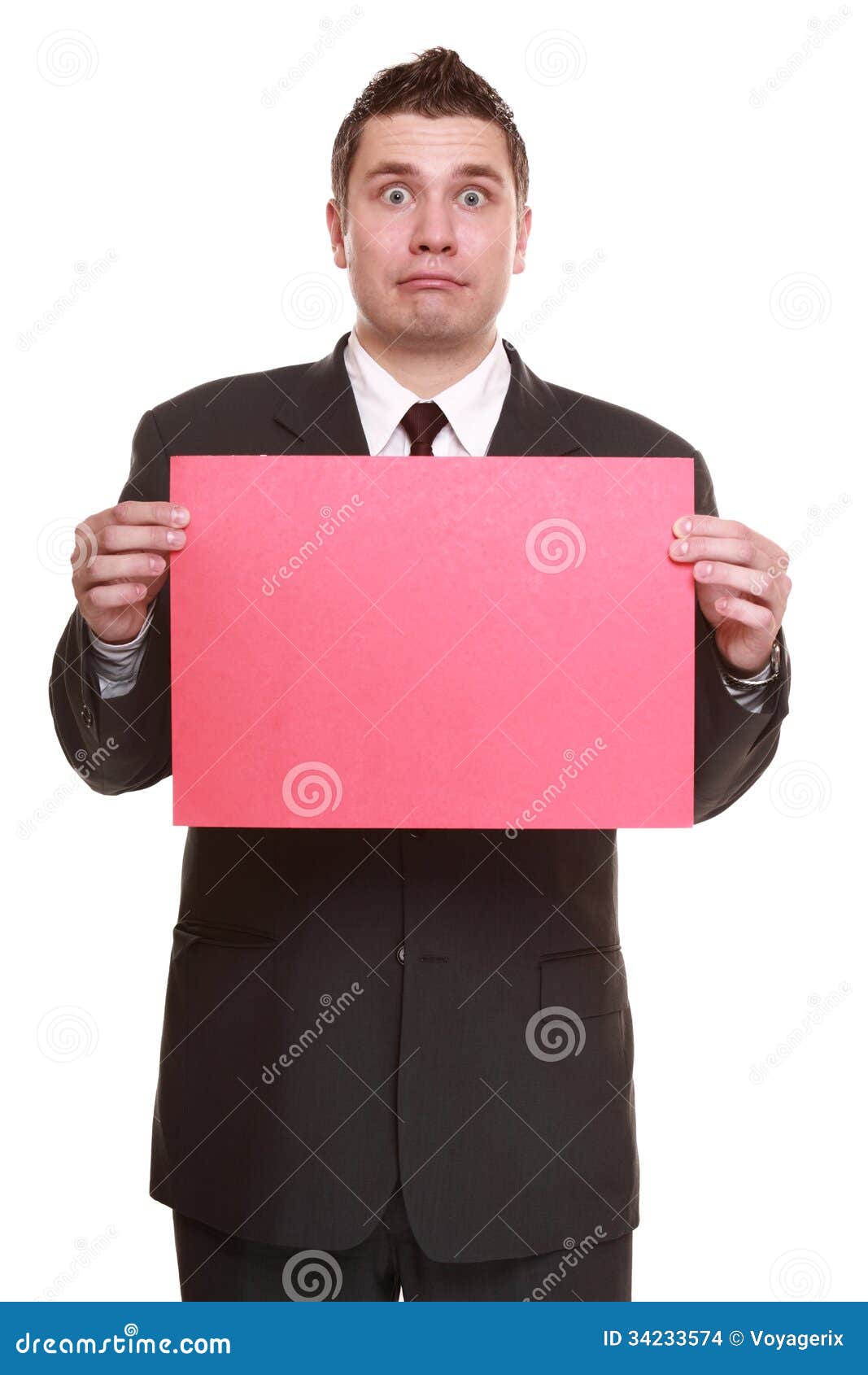 Pretty man holding empty white paper poster. Big billboard in hands of  handsome student. Studio portrait of person who keep blank board. Mockup  Stock Photo