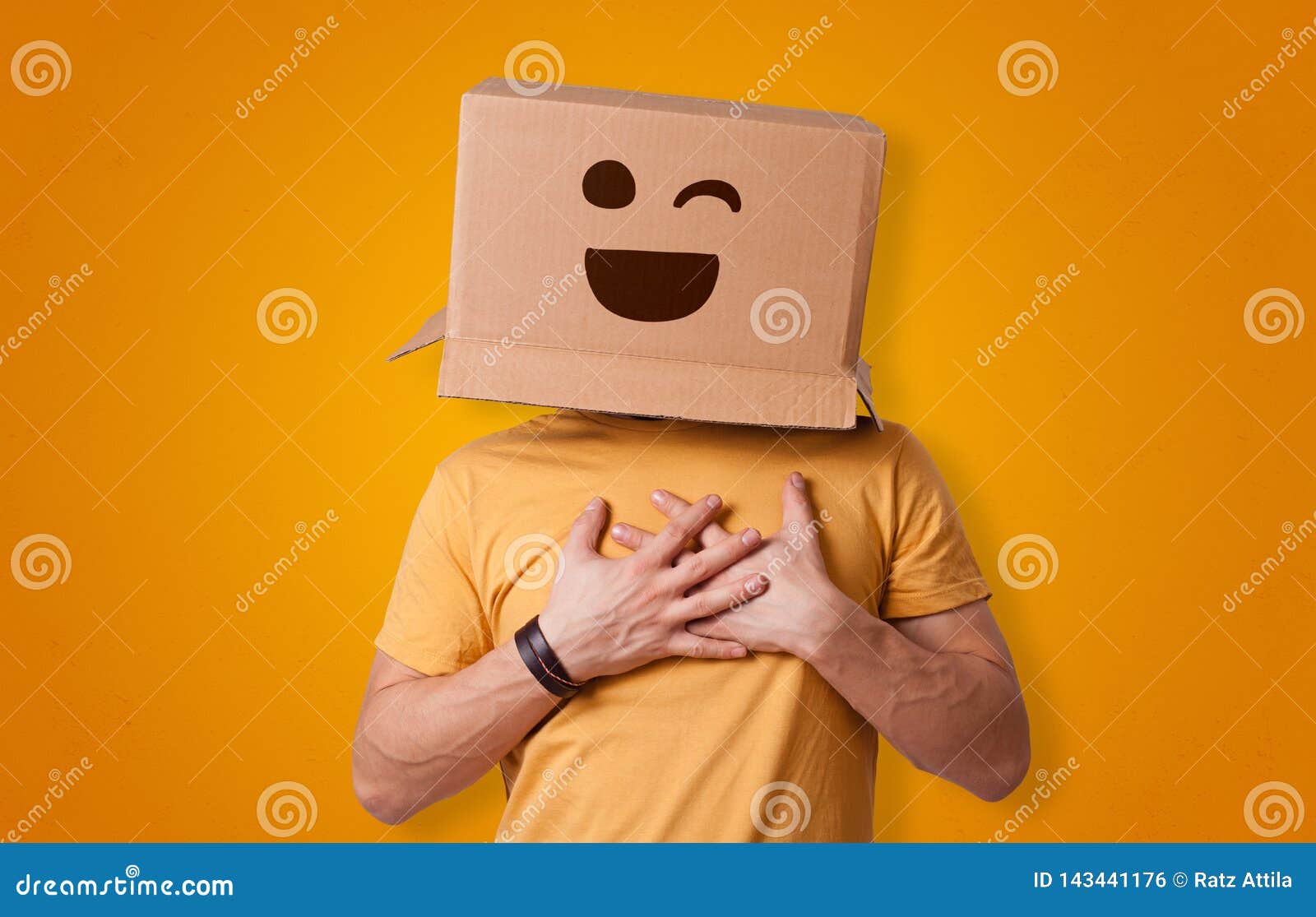 funny man smiling with cardboard box head