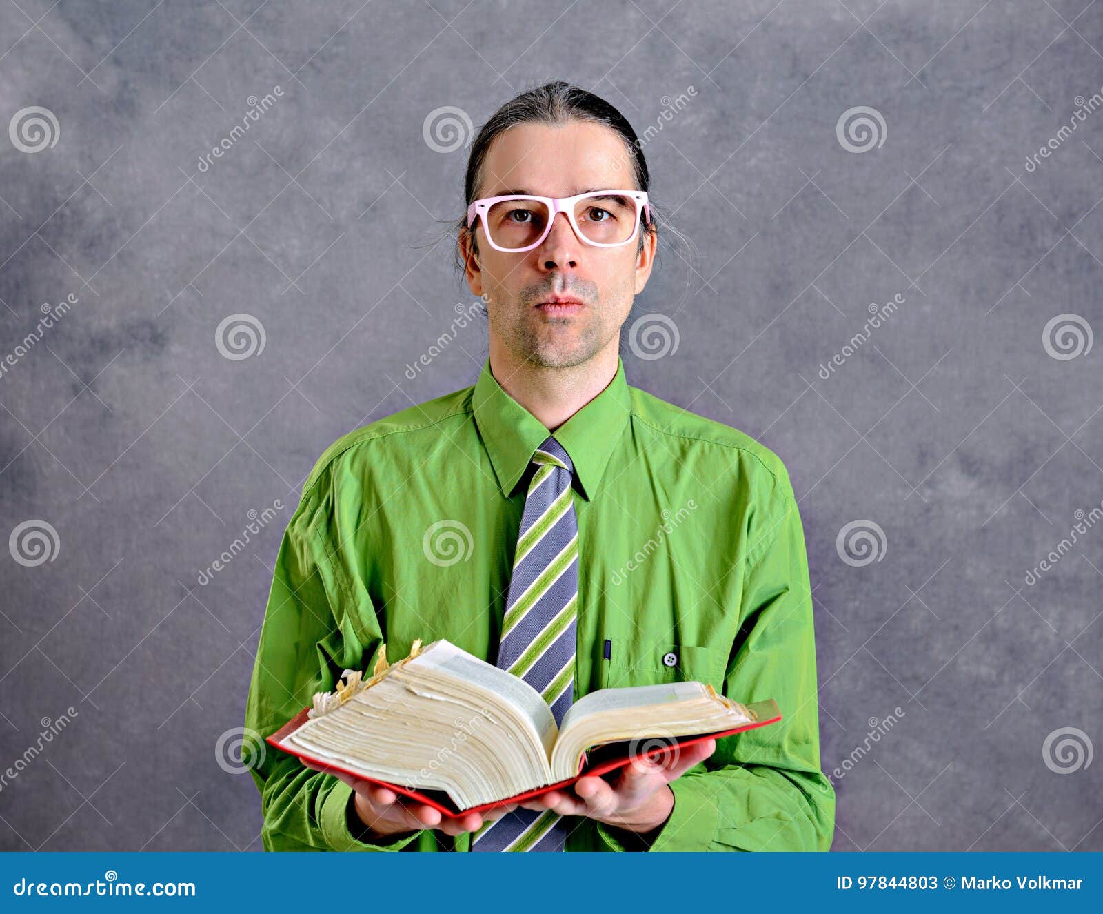funny man with statute book and pink glasses