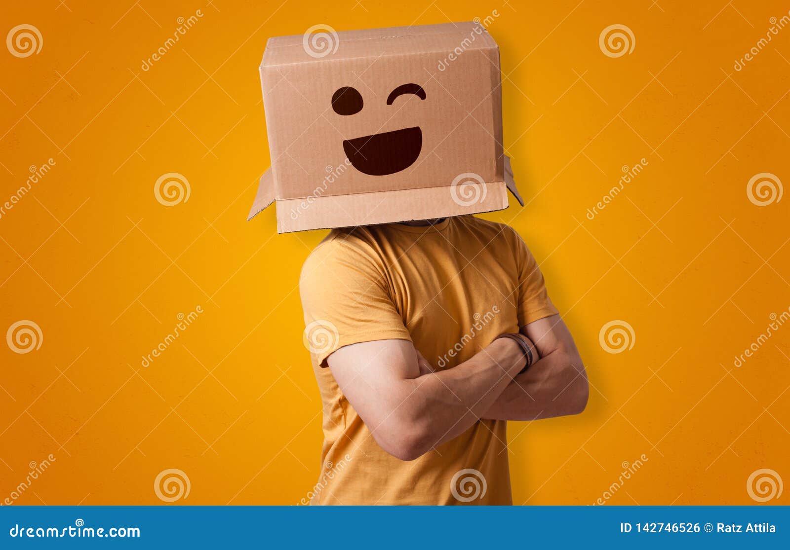 funny man smiling with cardboard box head