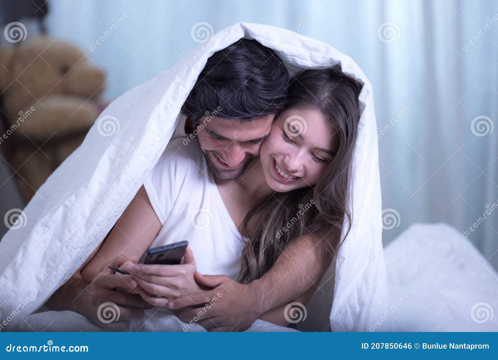 Funny Married Couple Lying in Bed and Hiding Under White Blanket Stock  Photo - Image of closeness, hiding: 207850646