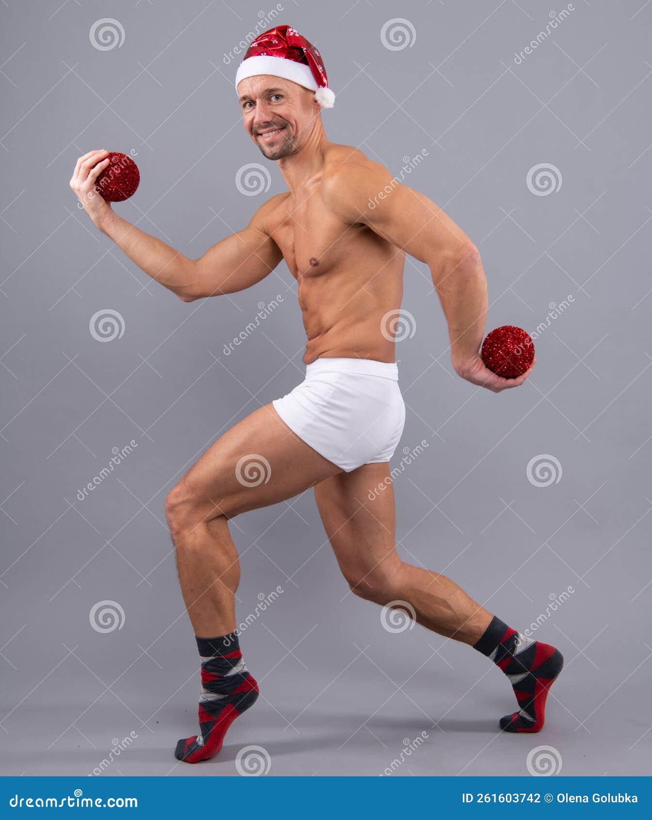 Funny Muscular Santa in Santa Hat and White Underwear. Christmas