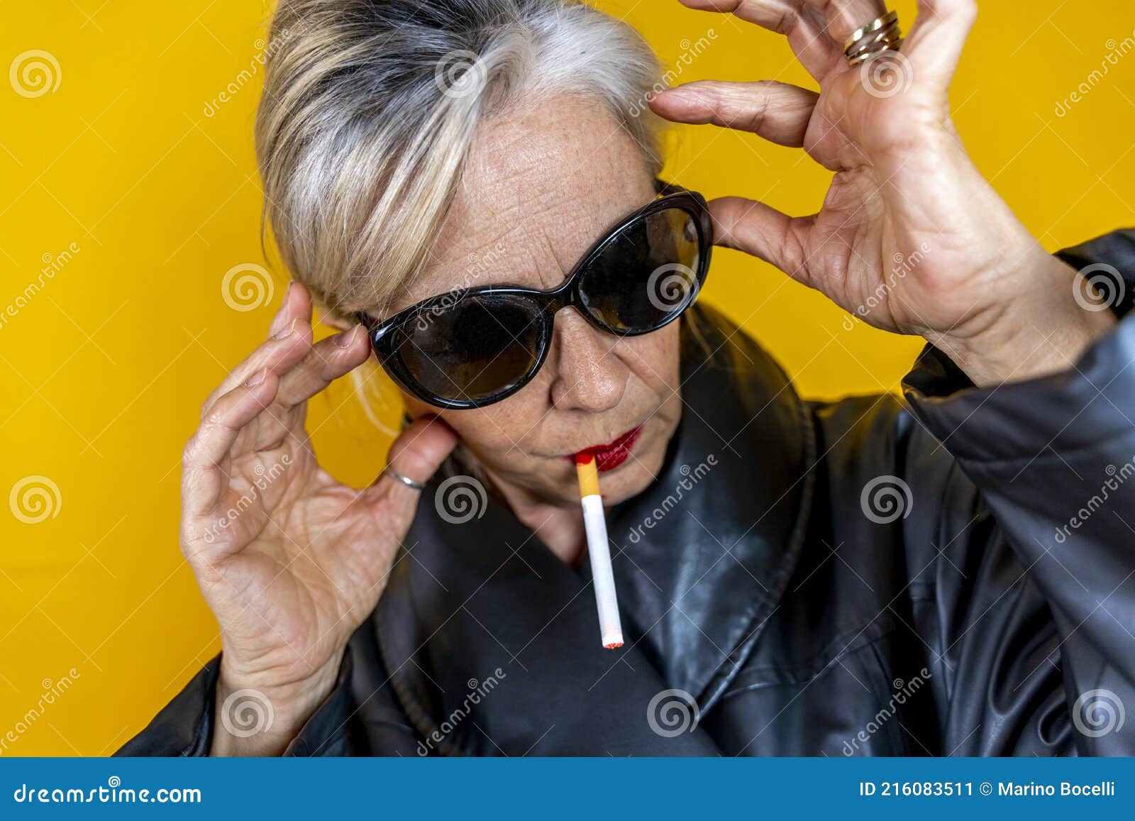 Funny Portrait of Mature Woman. Sophisticated Lady Having Fun Dressed in a  Leather Coat Smoking a Cigarette Stock Image - Image of fatale, concert:  216083511