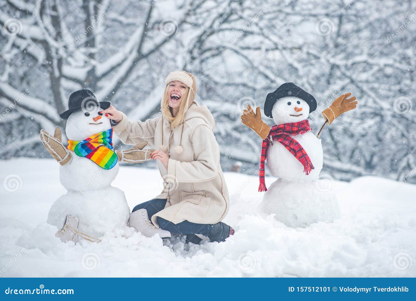 Funny Snowmen. Happy Smiling Girl Make Snowman on Sunny Winter Day ...