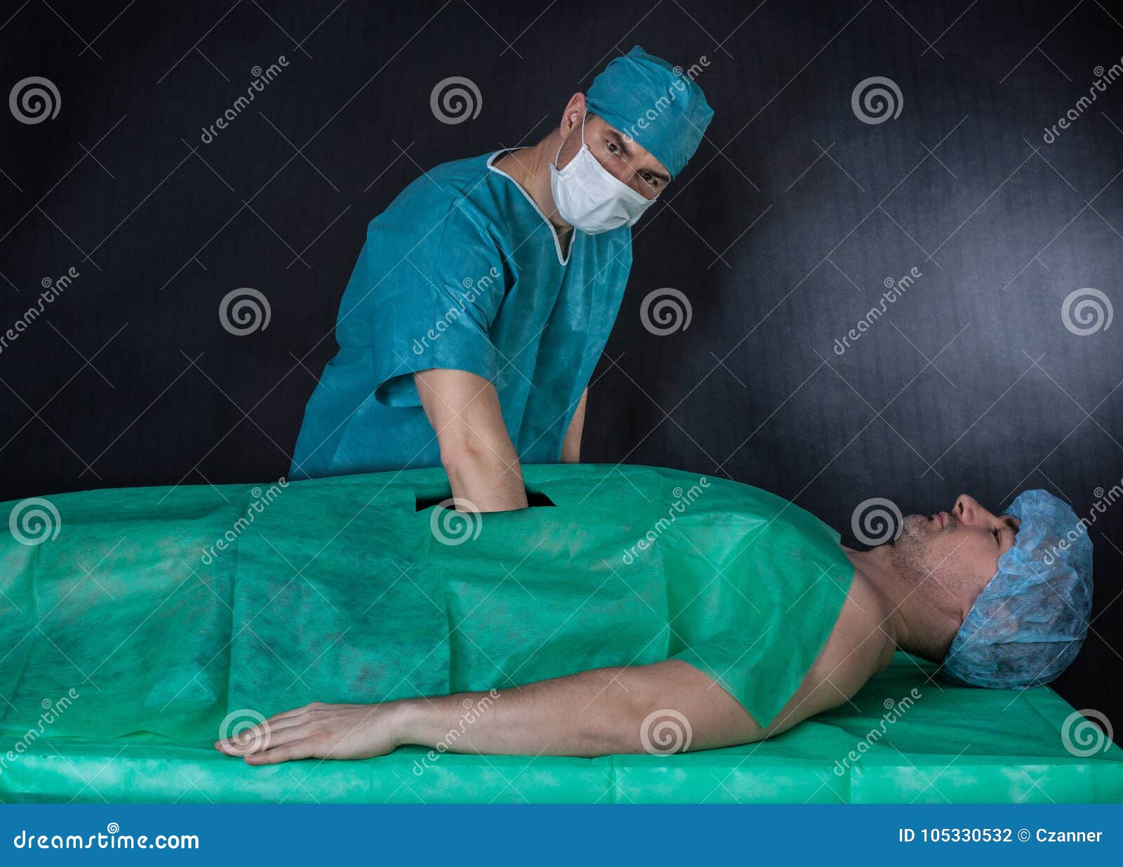 Funny Surgery Operation on a Black Background. Stock Photo - Image of hand, operation: 105330532 Funny Surgery Operation on a Black Background. Stock Photo - Image of hand, operation: 105330532