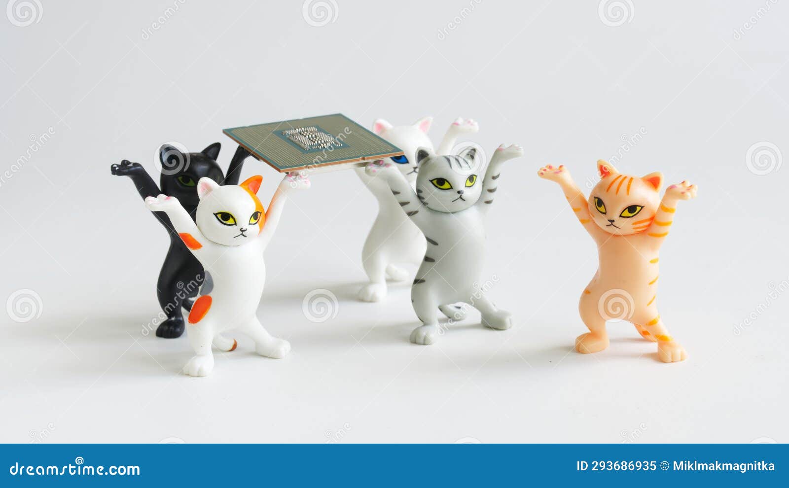 funny toy kittens with raised paws carry a modern powerful computer processor. assembling, overclocking and upgrading a computer.