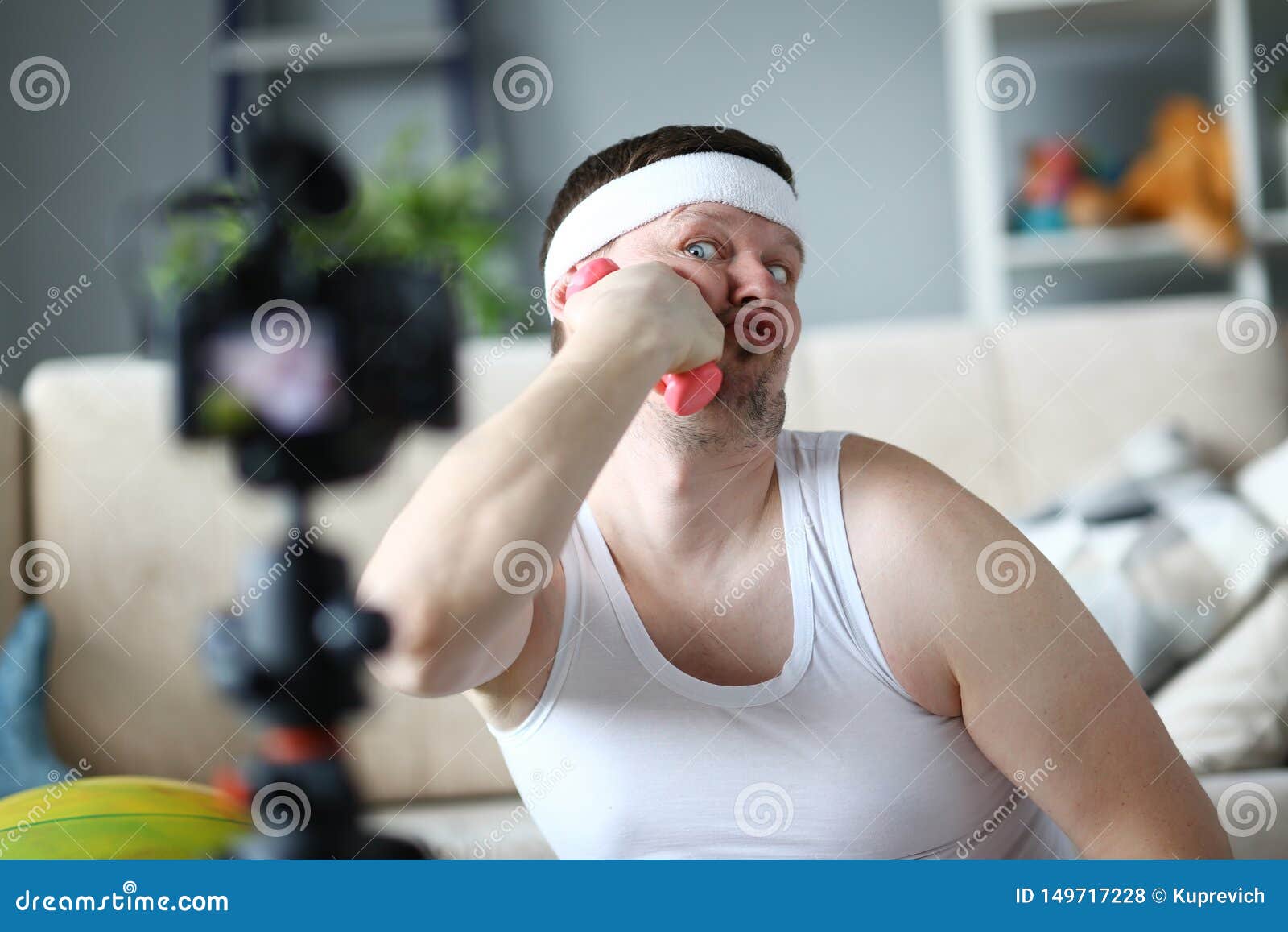 Funny Vlogger Joking and Put Dumbbell To Face Stock Photo - Image of funny,  posing: 149717228