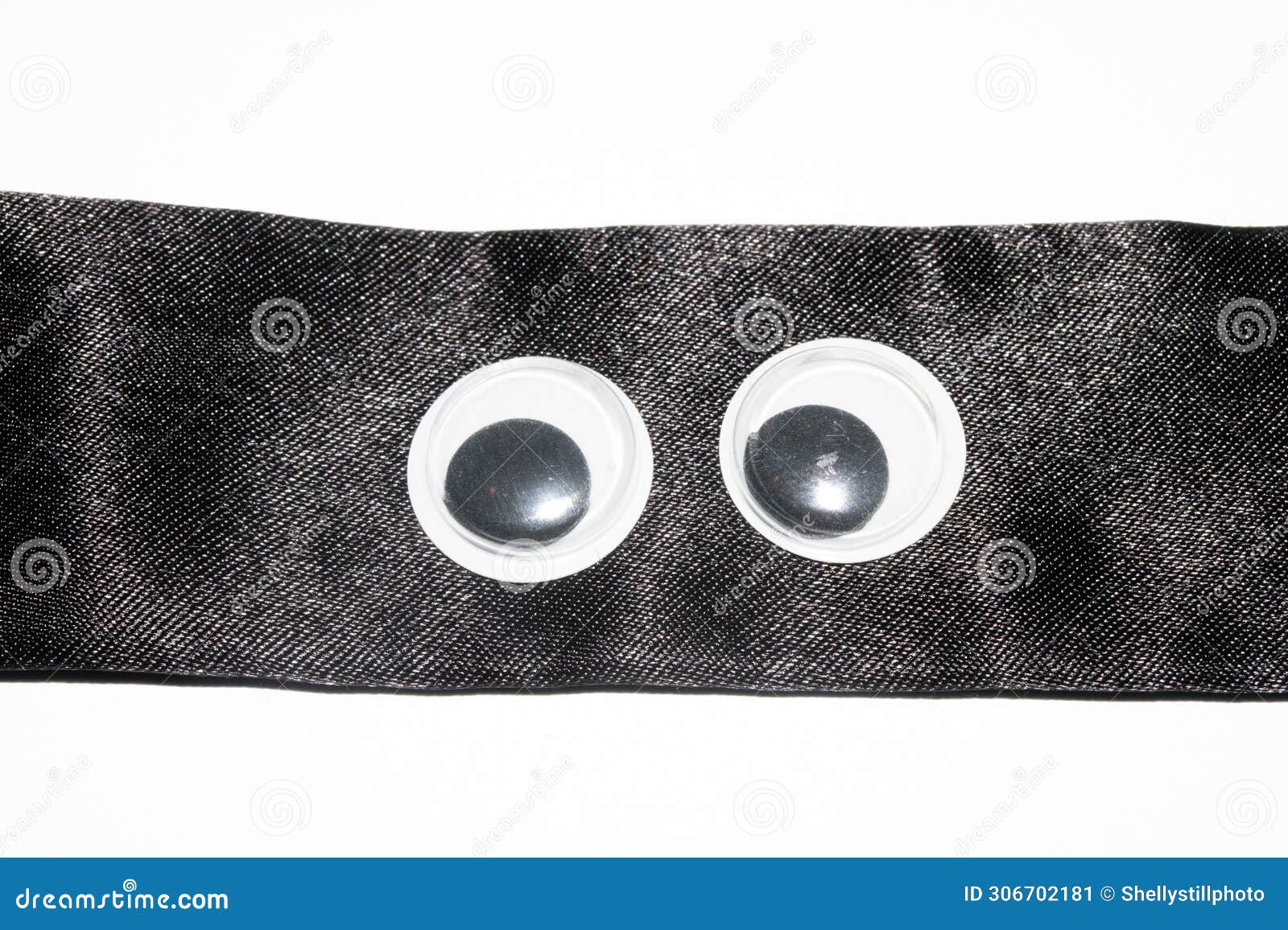 funny wiggle google eyes on fabric silly background