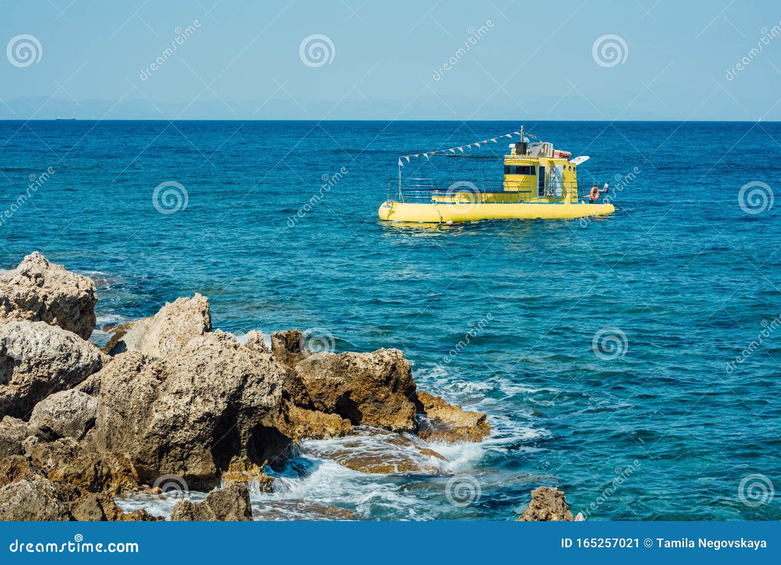 https://thumbs.dreamstime.com/z/funny-yellow-diving-boat-lots-flags-different-countries-blue-sea-over-rocky-shore-rhodes-island-greece-hot-summer-165257021.jpg