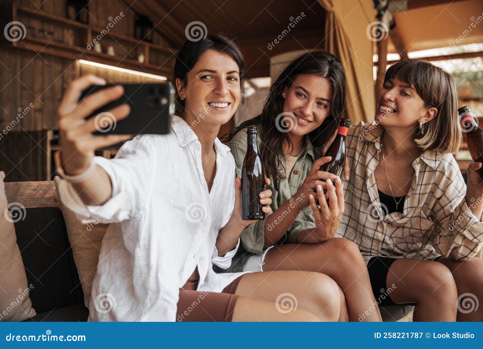 Funny Young Caucasian Girls Make Joint Selfie on Phone Relaxing Indoors ...