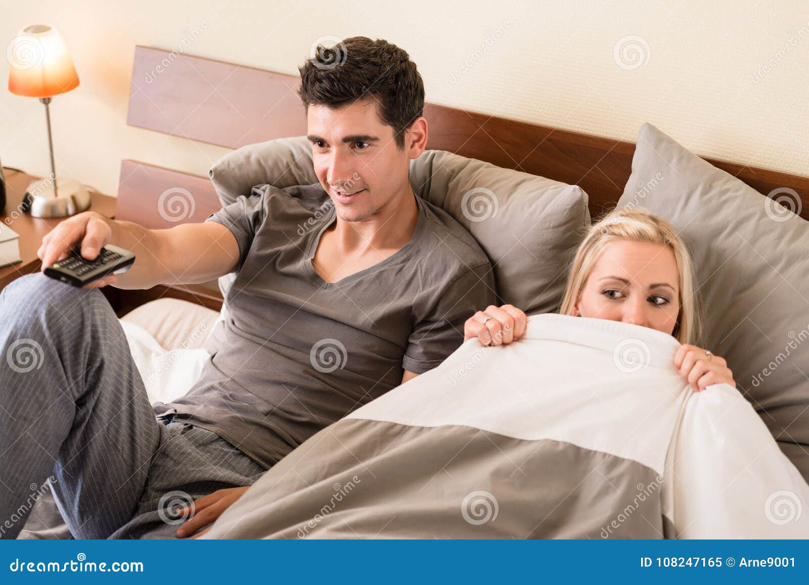 Couple Sitting in Bed while Watching TV Stock Image Image of couple