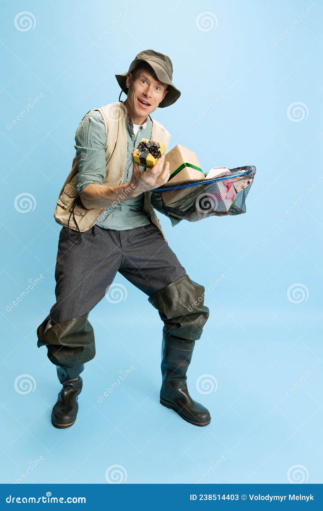 Funny Young Man, Fisherman with Fishing Accessories Wearing Sport Style  Clothes Isolated Over Blue Studio Background Stock Image - Image of  recreation, brown: 238514403