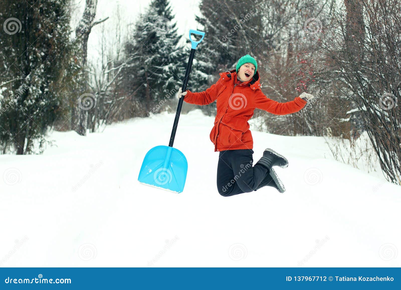 Funny Young Woman Jump with Snow Shovel on Rural Road. Winter ...