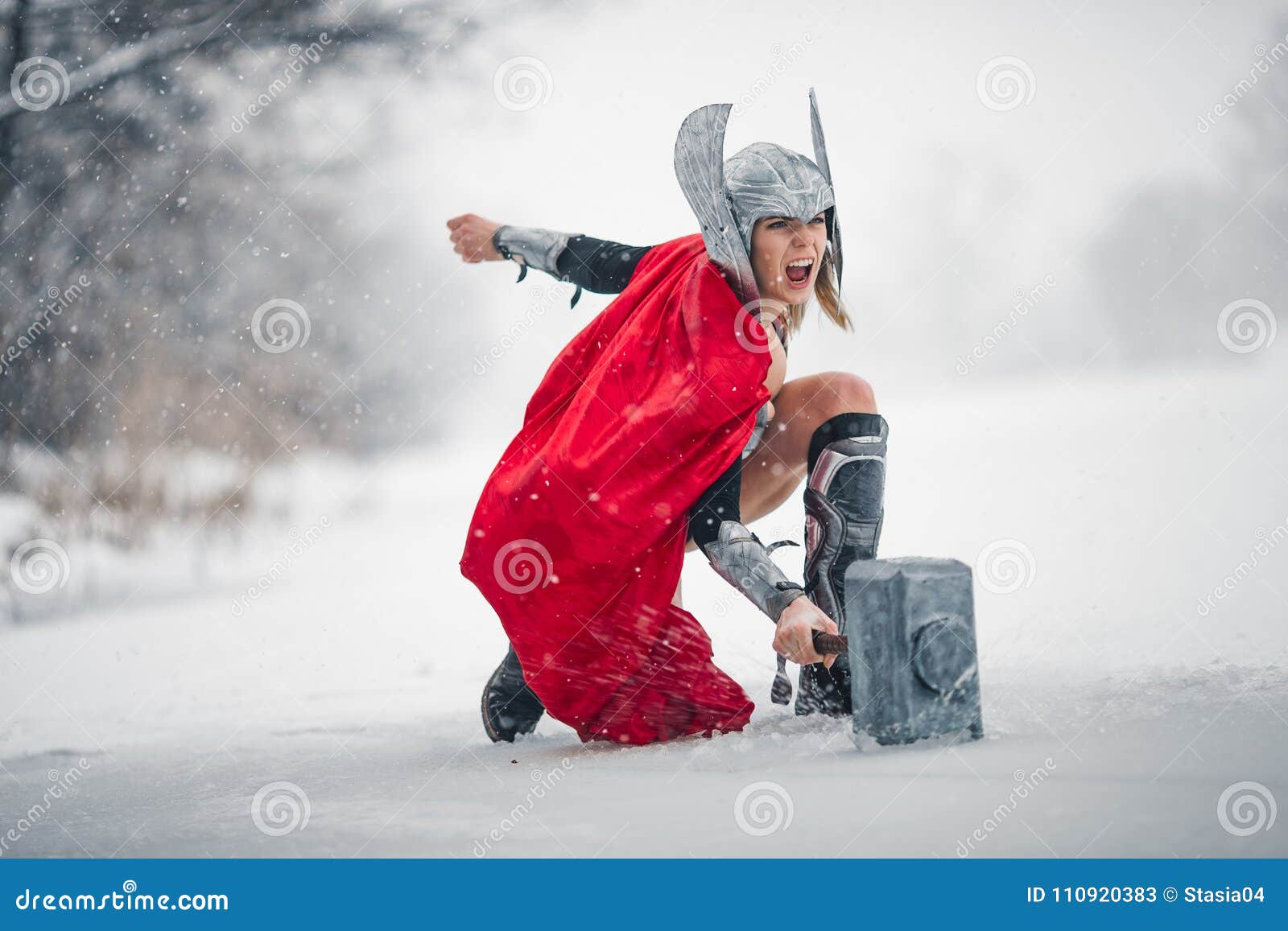 furious woman in image of germanic-scandinavian god of thunder and storm. cosplay.