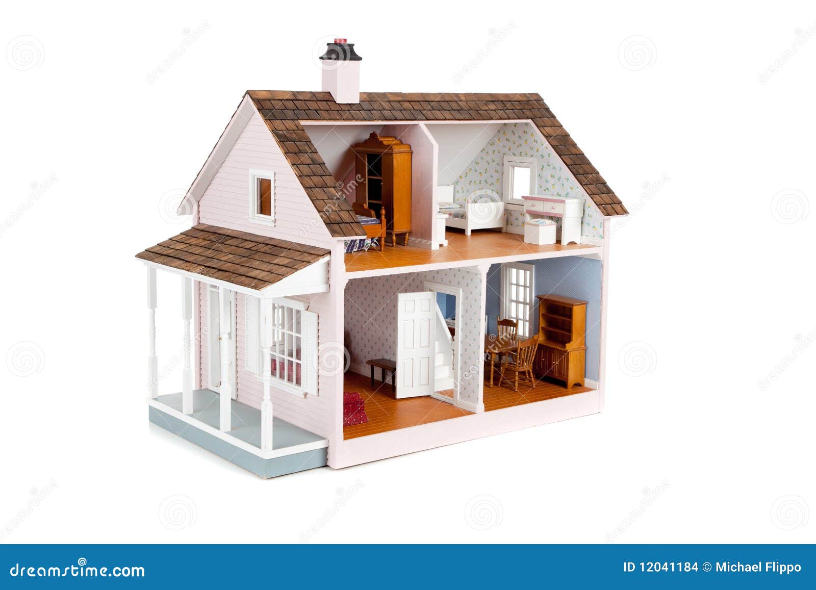 furnished pink doll house on white