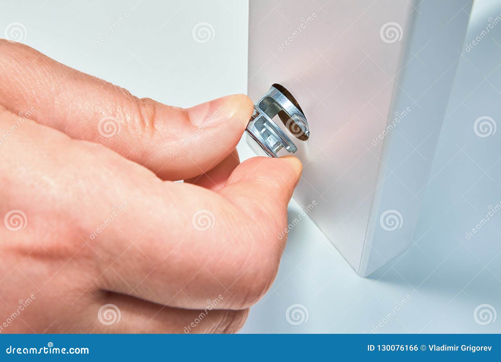 Furniture Assembler Fixes Cam Lock Nut, Furniture Assembly. Stock Photo