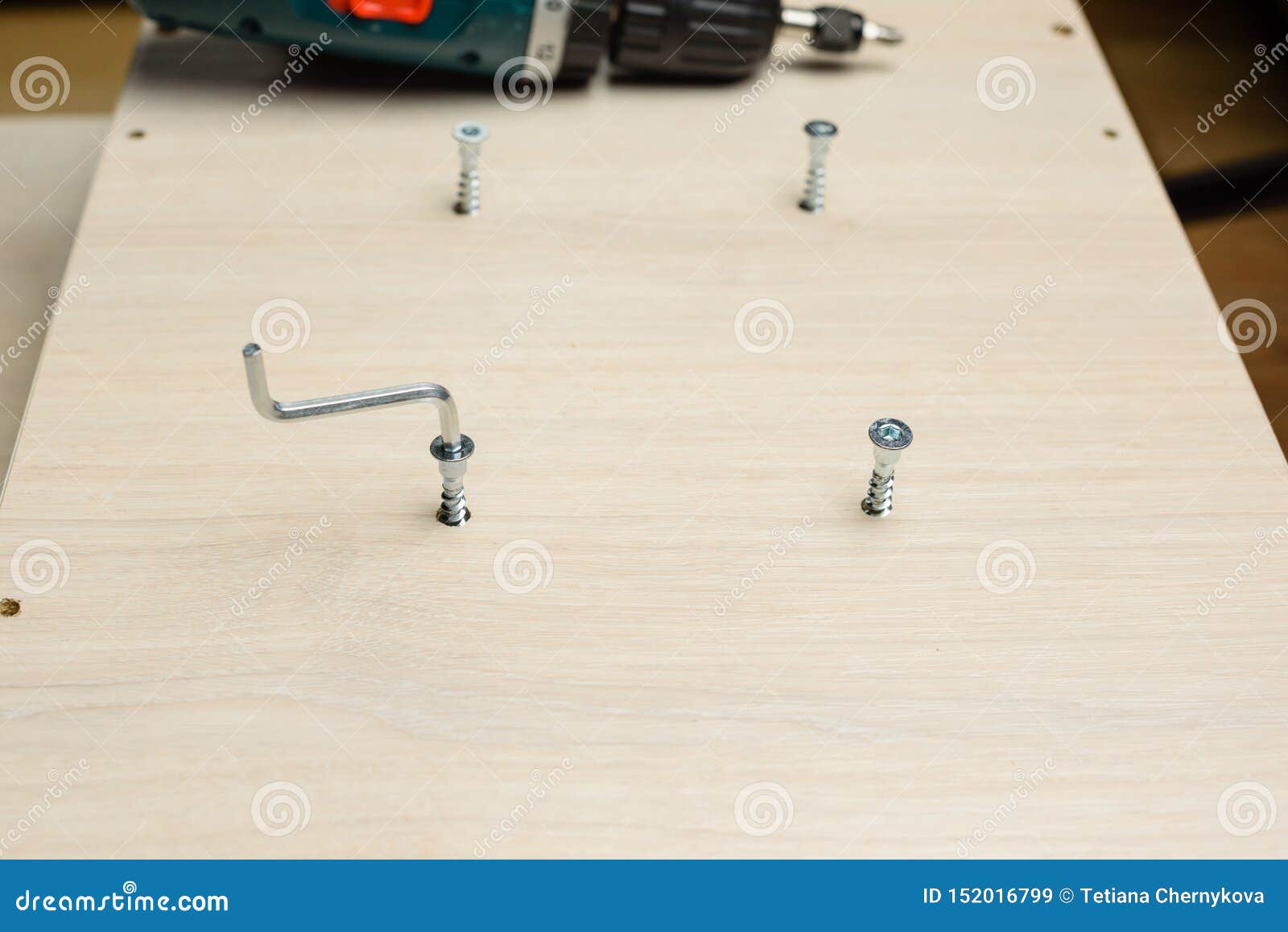 https://thumbs.dreamstime.com/z/furniture-assembly-using-tools-cordless-screwdriver-clips-clamps-close-up-assembling-flat-pack-furniture-furniture-assembly-152016799.jpg