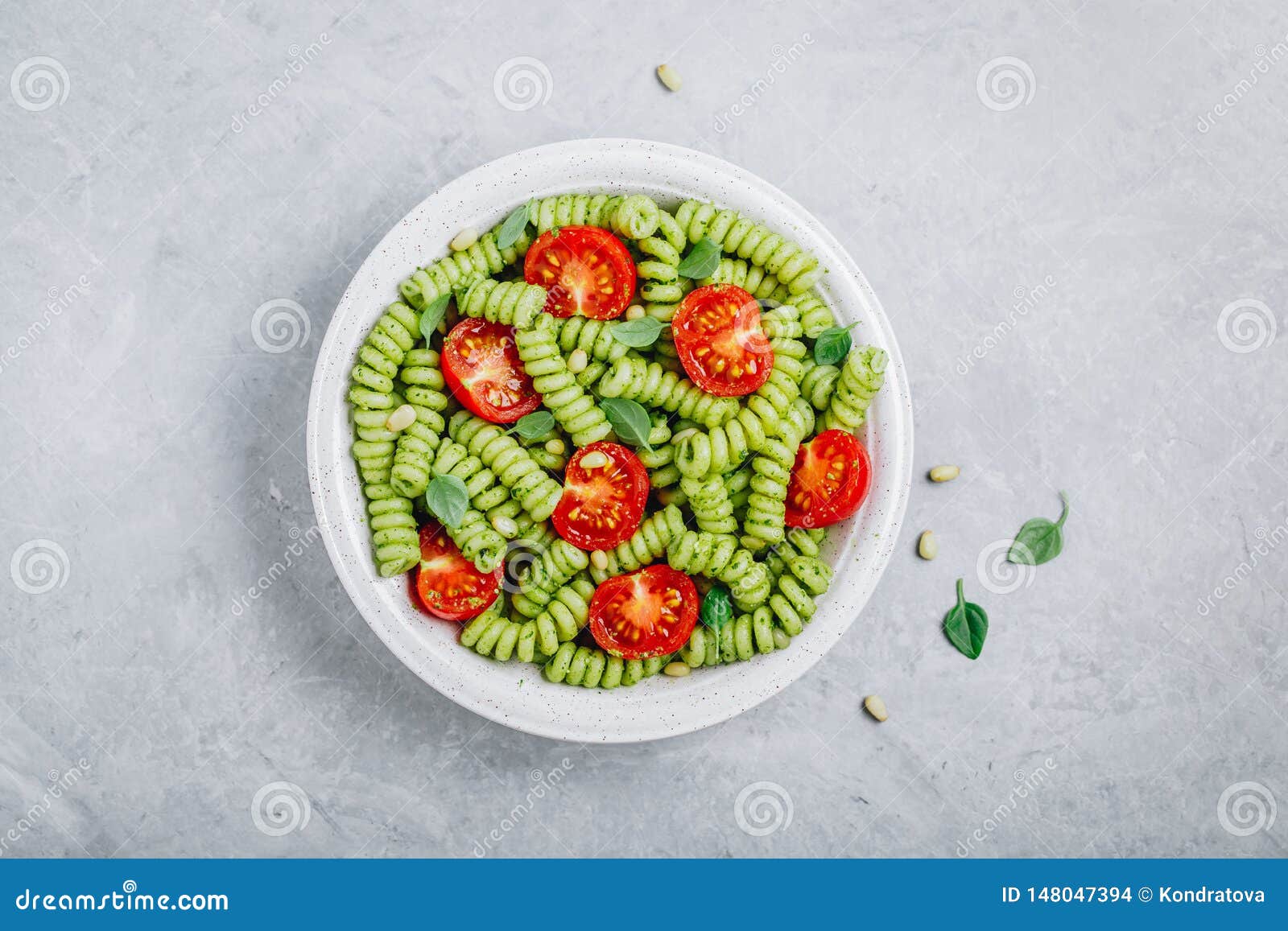 Fusilli Pasta with Basil Pesto Sauce , Tomatoes and Pine Nuts Stock