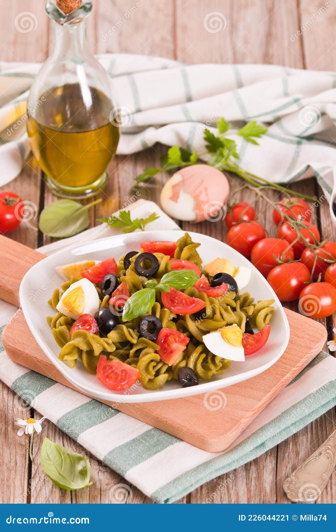 Fusilli Pasta with Cherry Tomatoes, Eggs and Black Olives. Stock Image