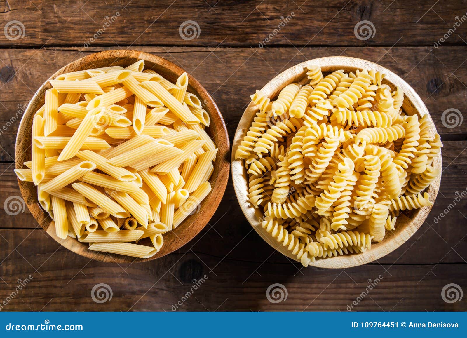 fusilli and penne rigate as raw pasta