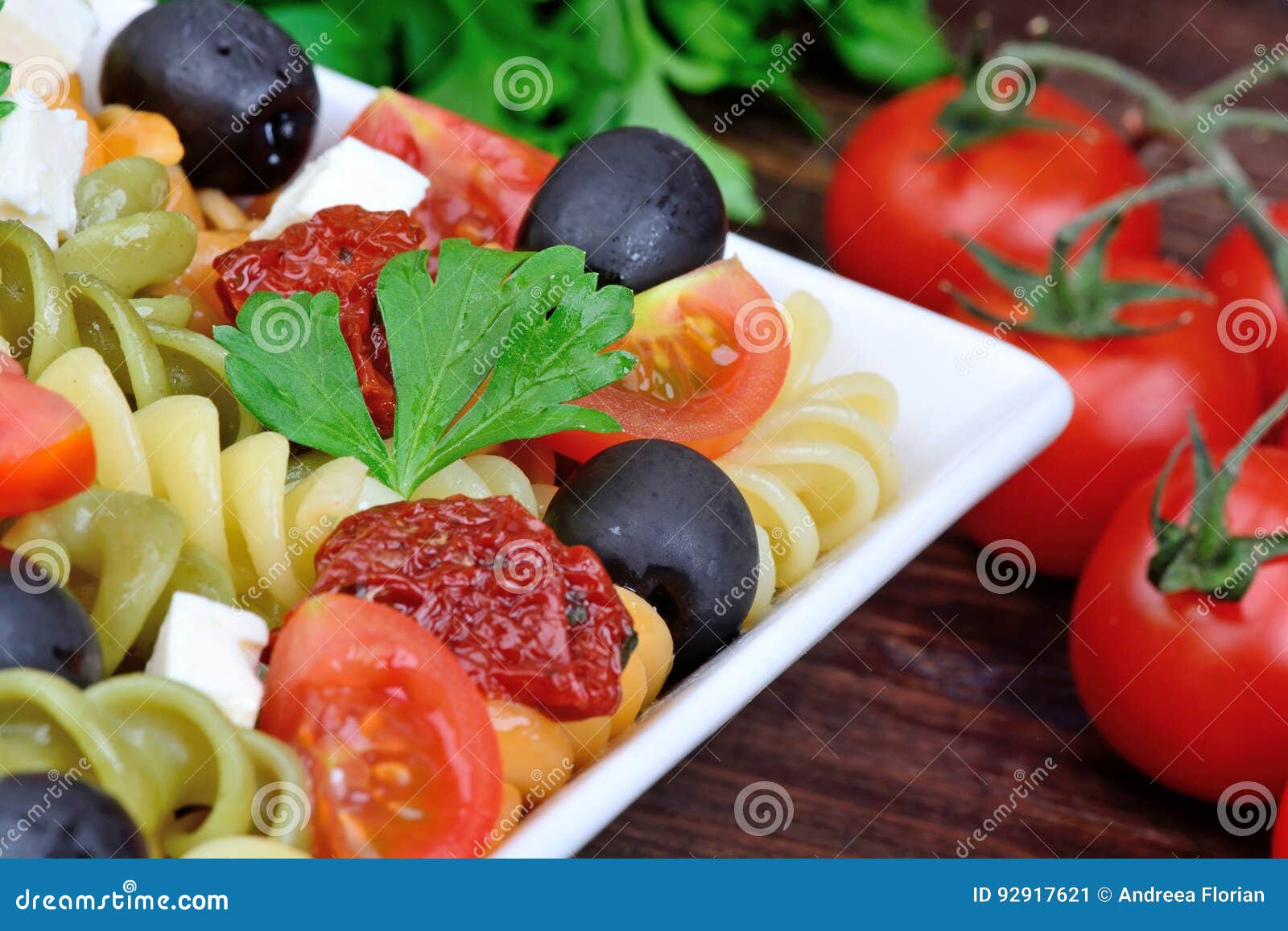 Fusilli with Tomato, Olive and Cheese in a Plate Stock Image Image of