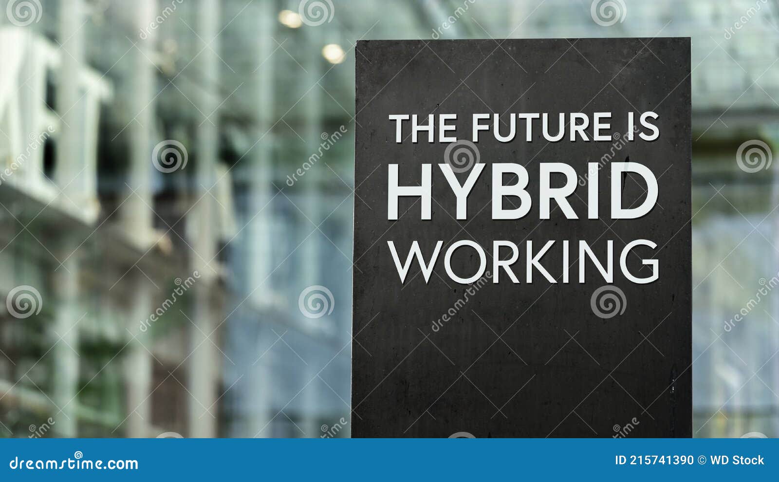 the future of work is hybrid sign in front of a modern office building