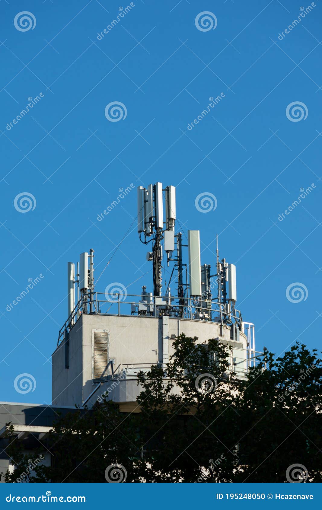 5G and 4G Mobile Phone Antennas Installed on the Rooftop of a Building