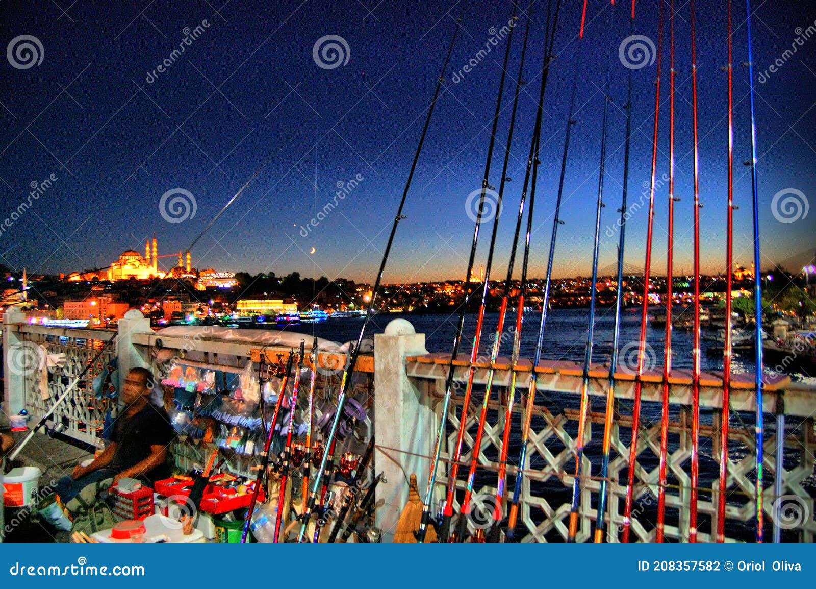 galata bridge (istanbul  turkey). fishermans at night