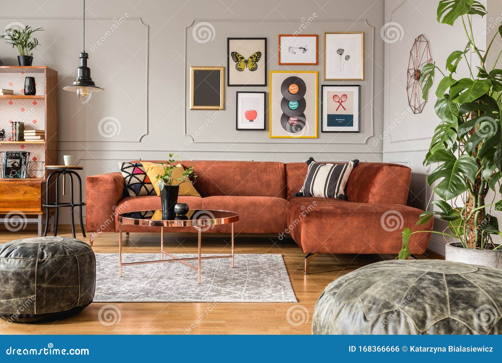 Gallery of Posters in Elegant Grey Living Room Interior with Brown ...