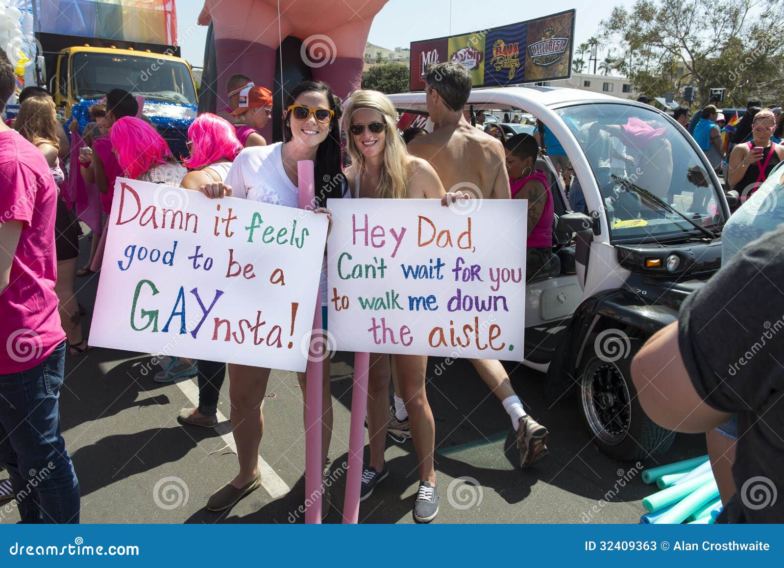 gals-signs-gay-pride-parade-two-women-pose-waiting-start-san-diego-32409363.jpg