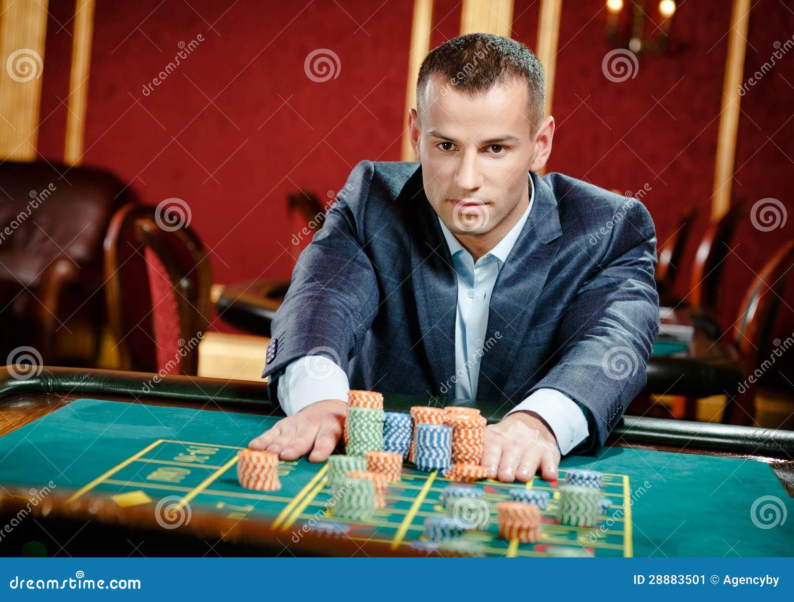 Gamblers placing their bets at a roulette table