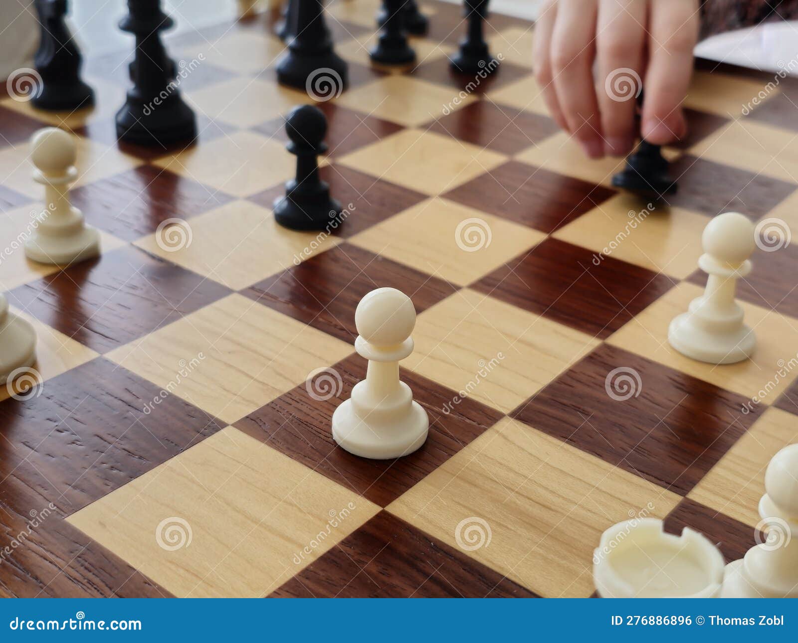 A Game on a Chess Board with Black and White Pieces Stock Photo Image