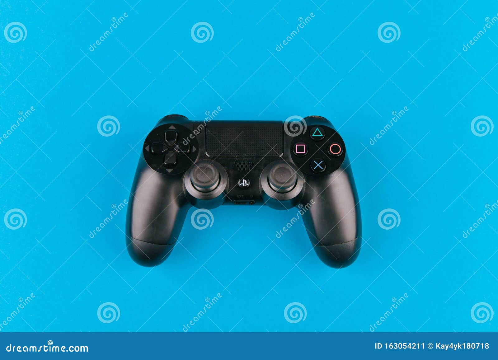 Game Joystick. Playstation. on a Blue Background Top View. the New Sony