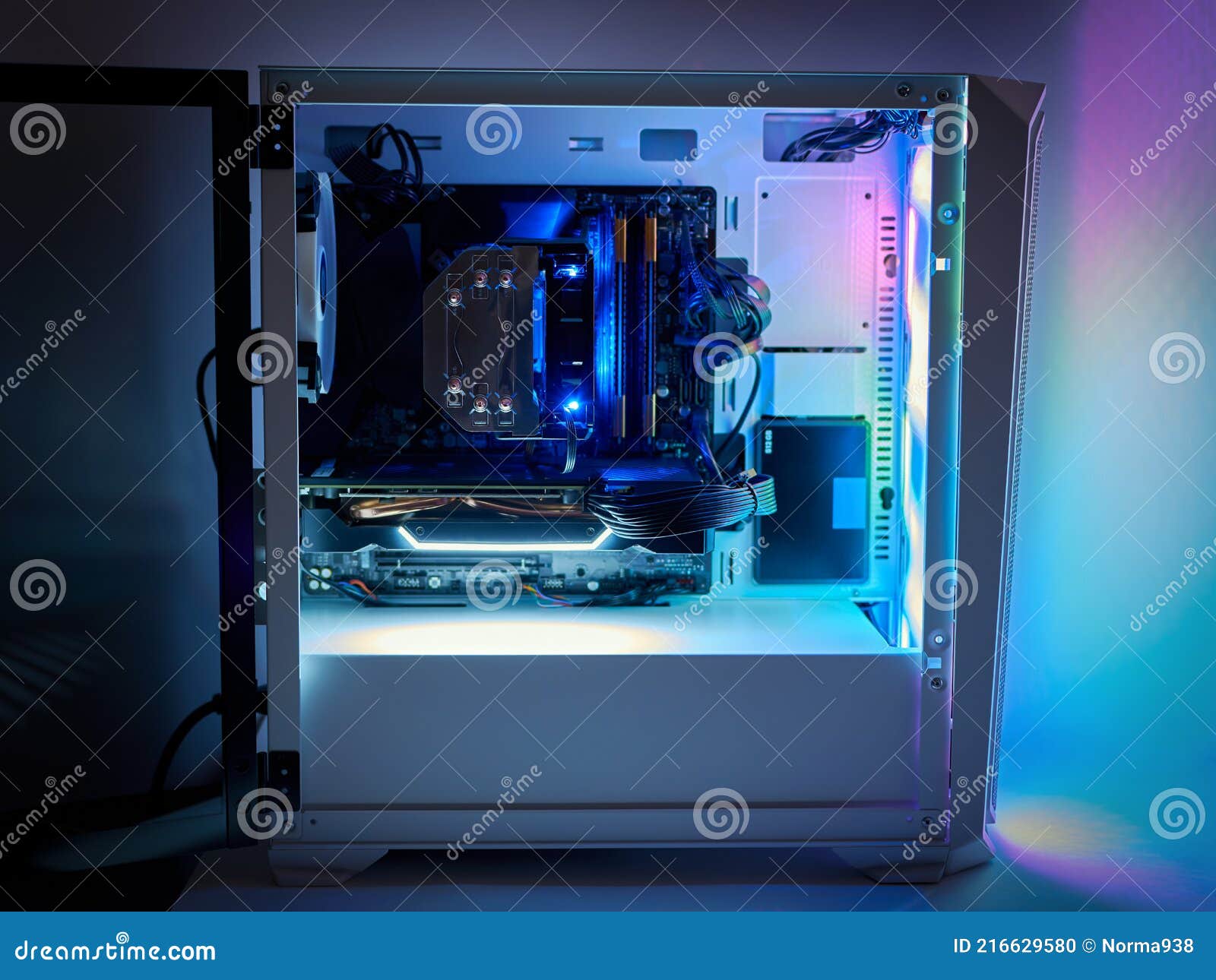 gaming pc and cpu cooling fan with backlight. desktop gaming computer with rgb led light inside. concept of esports